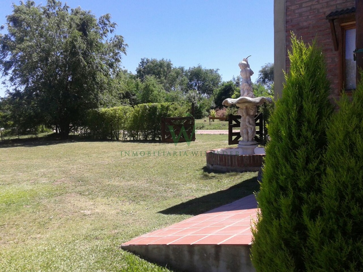 Casa 2 dormitorios + monoambiente y piscina. (COD 555)
